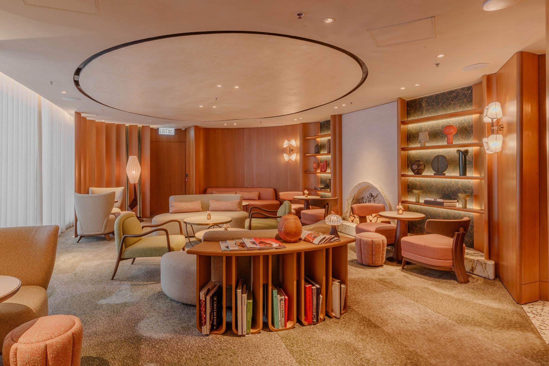 The above Lounge’s welcoming and luxurious communal area, designed by André Fu