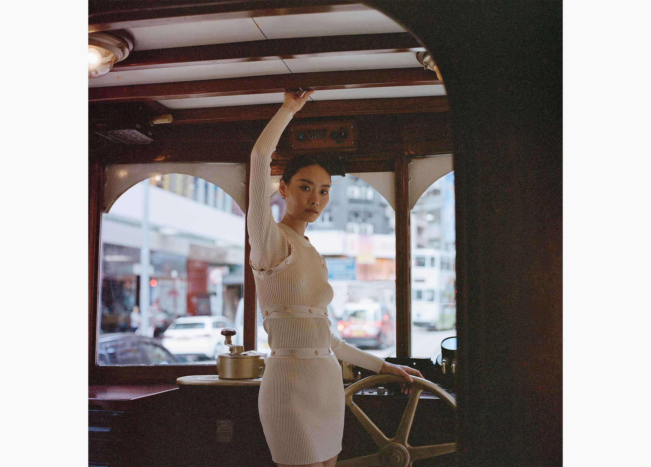 A model poses in Hermès on a Hong Kong tram