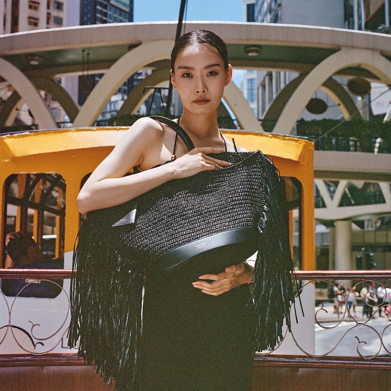 A model poses in Ferragamo on the streets of Hong Kong