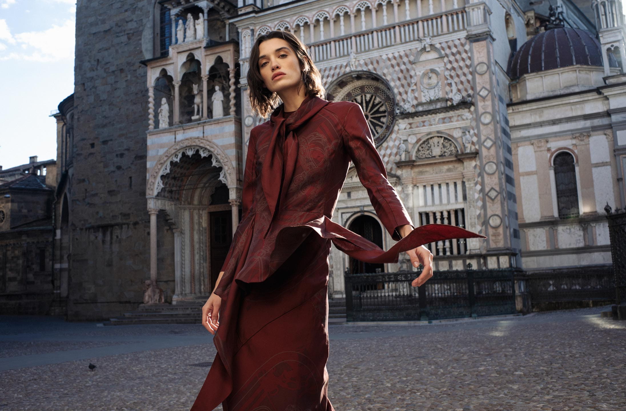 A model poses in Bergamo wearing Hermès