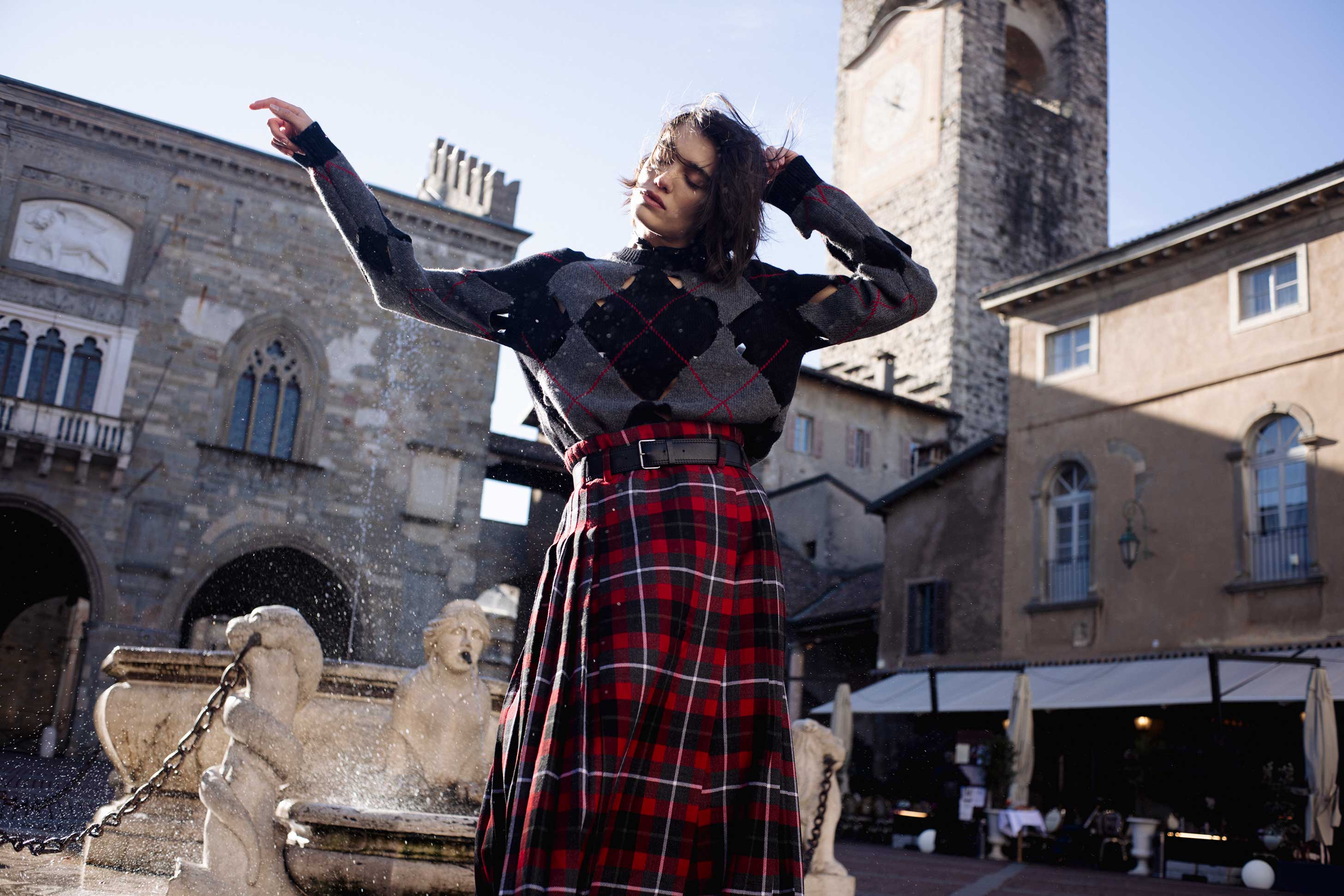 A model poses in Bergamo wearing Dior