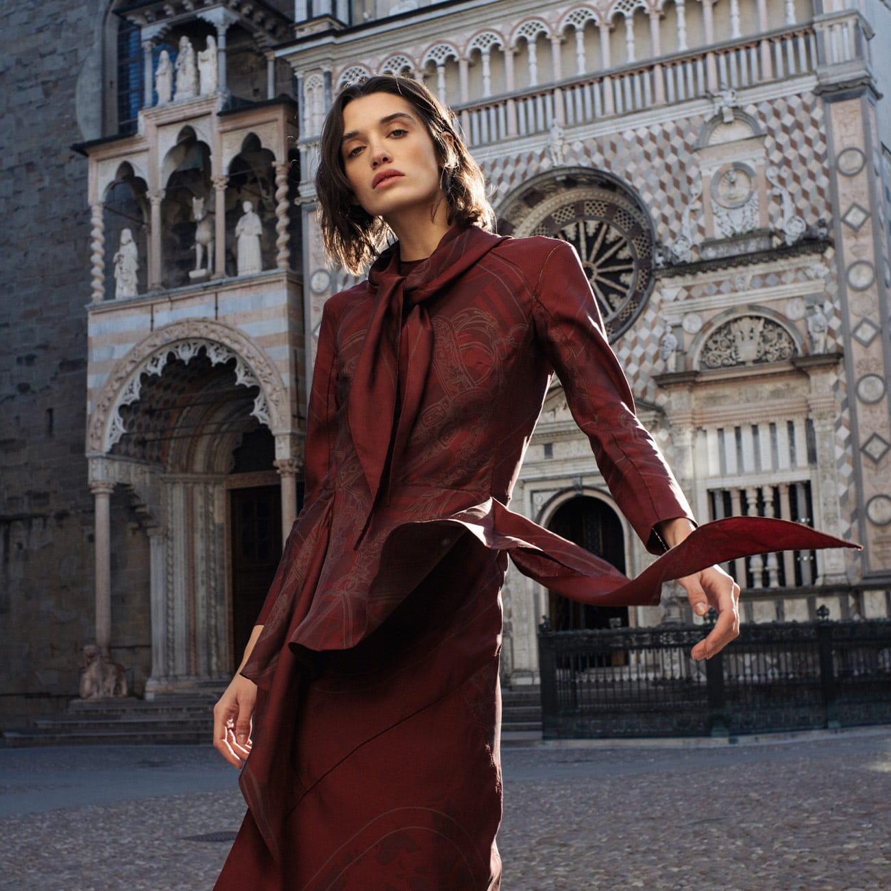 A model poses in Bergamo wearing Hermès