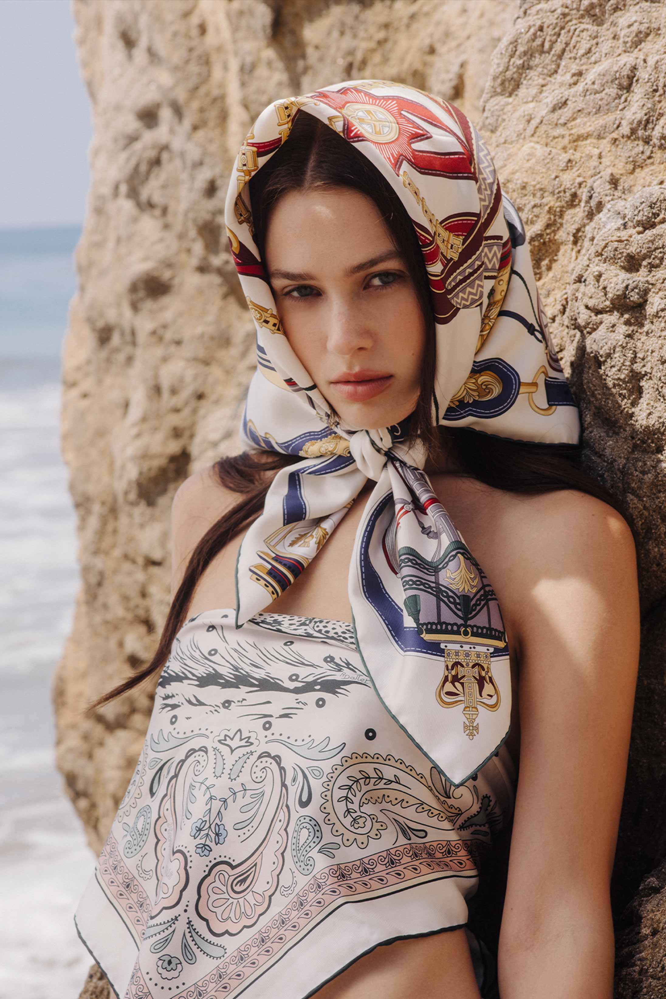 A model poses in Hermès at the beach in Malibu