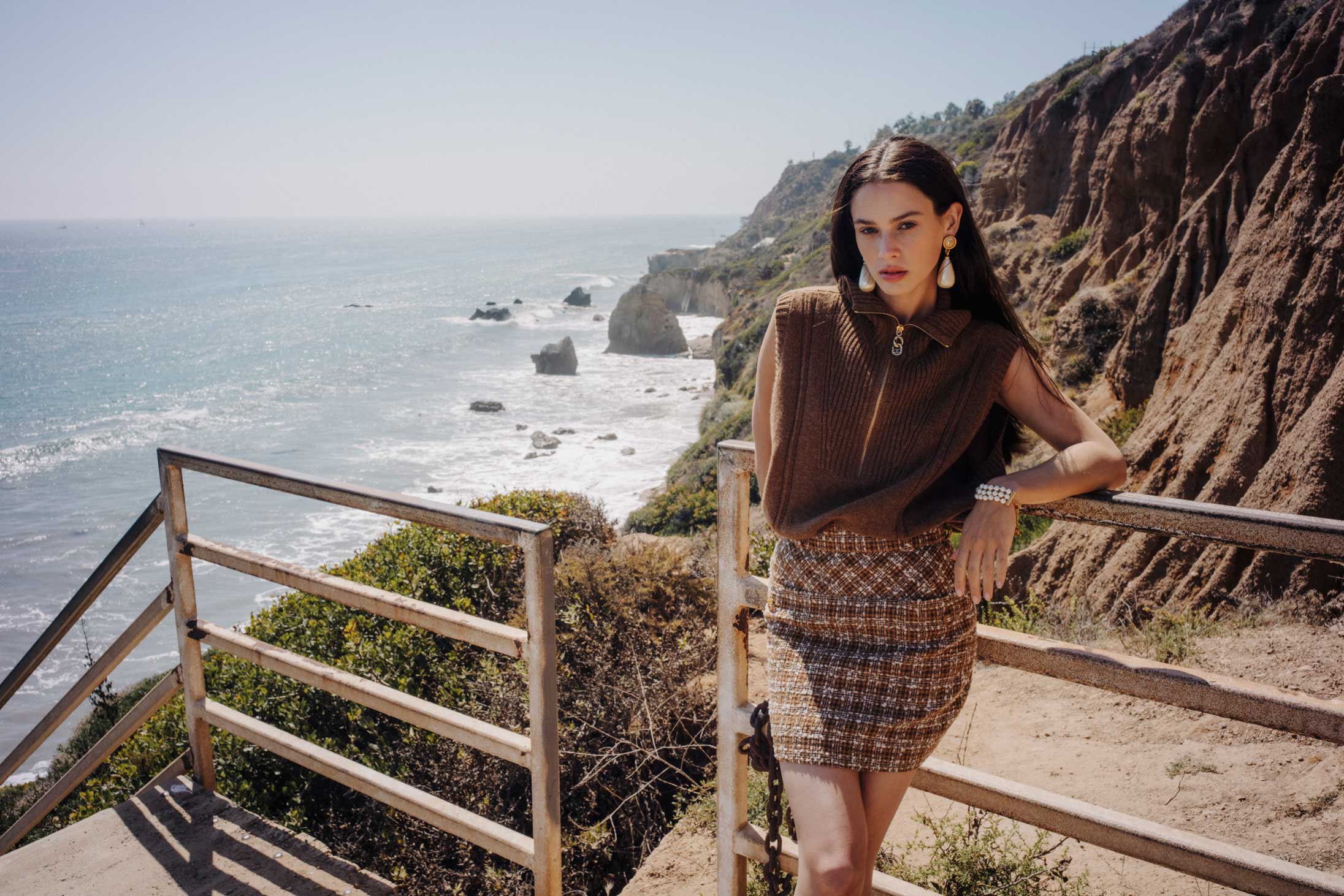 A model poses in Chanel at the beach in Malibu