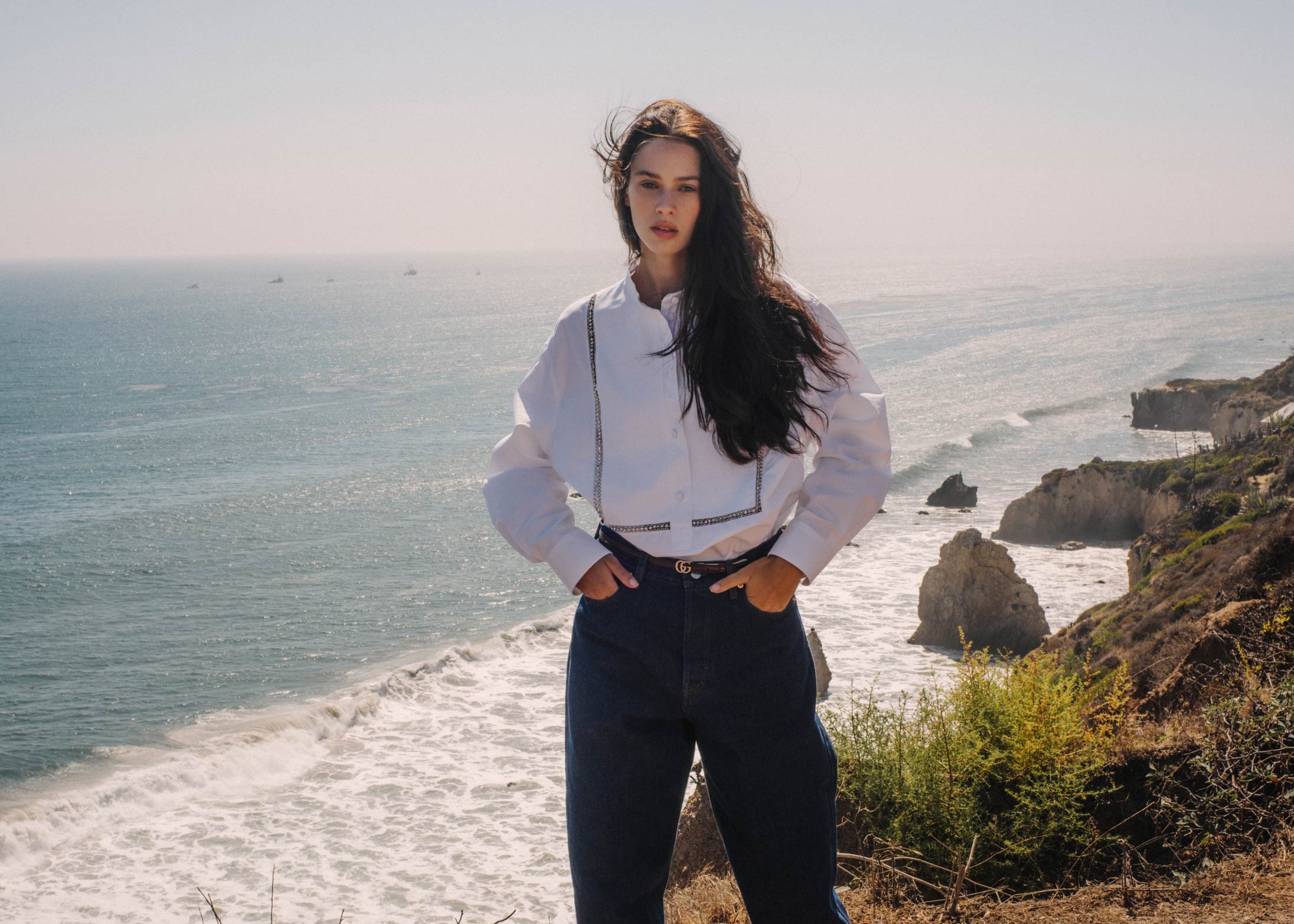 A model poses in Gucci at the beach in Malibu