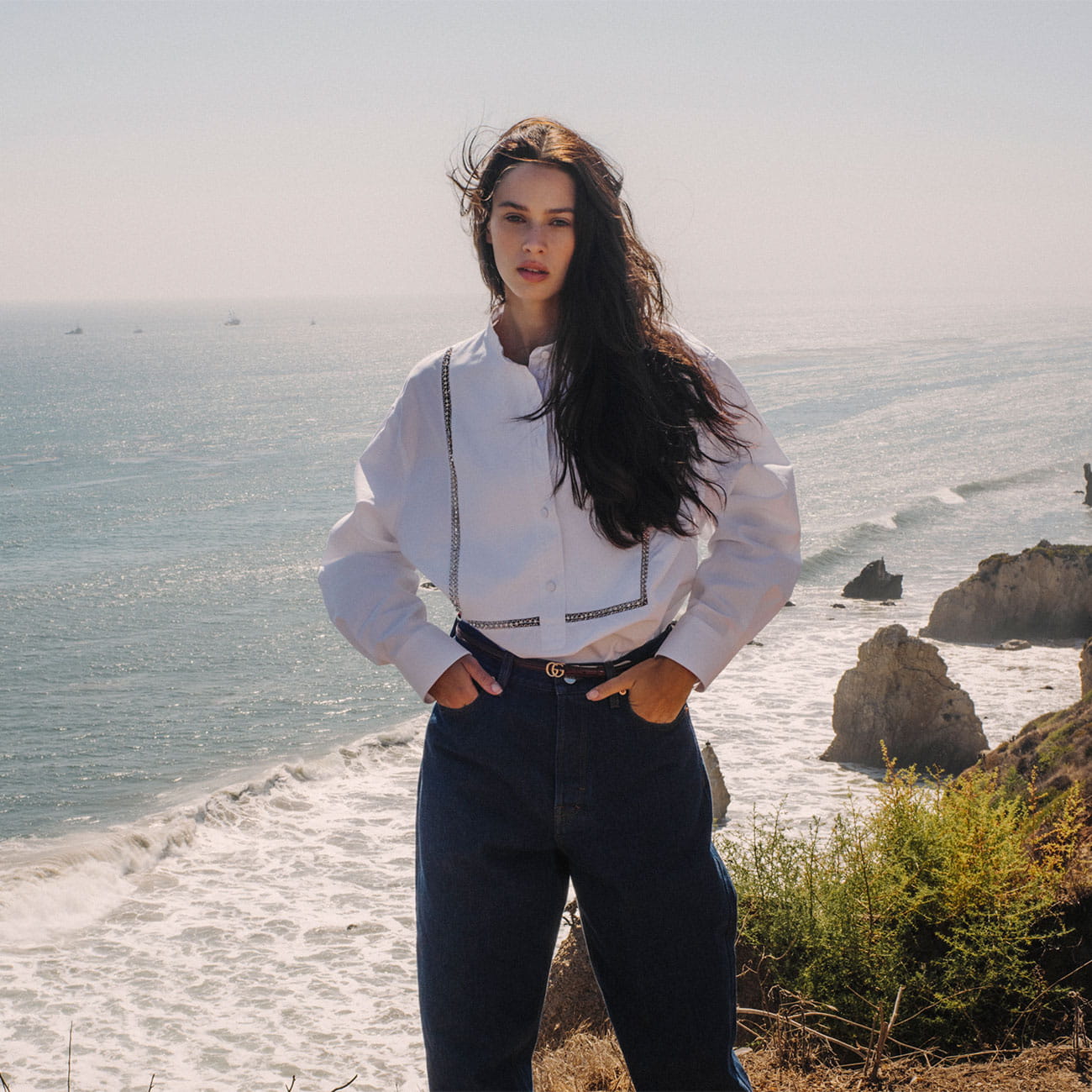 A model poses in Gucci at the beach in Malibu