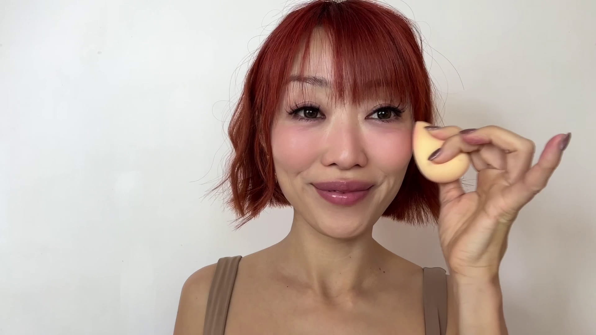 A makeup artist creating a Valentine's Day blush look